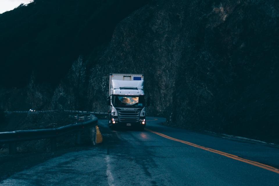 A freight truck on a highway.